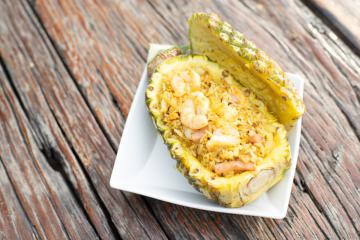 Fried rice in a natural bowl of pineapple