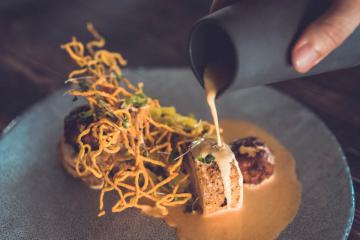 Chiang Mai Khao Soi - Khlong farms sous vide chicken breast, chicken croquet, fragrant yellow curry, yellow egg noodles, pickled cabbage, peanuts, coconut foam