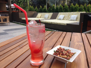 Refreshing cocktail in the outdoor lounge area