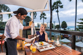 Carving some meat from a Brazilian Churrasco (Rodizio) dish